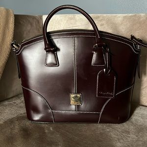 Like new authentic Dooney and Burke Bag no scuffs or scratches never used